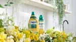 Two new Comfort innovations on a washing machine surrounded by flowers.